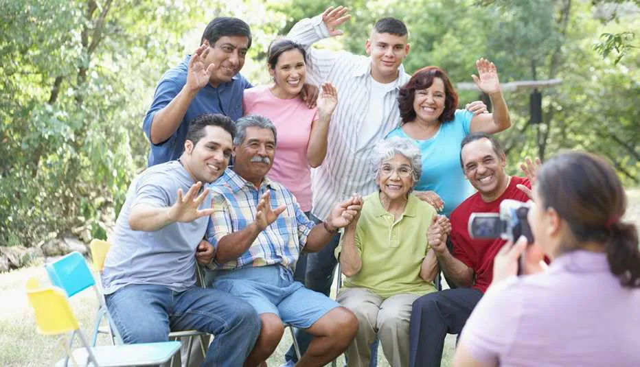 1140-rear-view-of-a-woman-taking-photograph-of-a-three-generation-family-esp